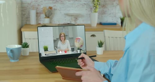 Woman Watching Online Learning Video at Home