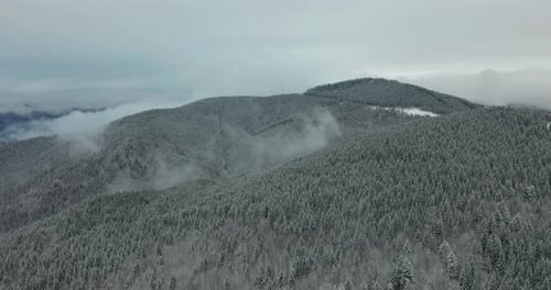 Aerial View. Scenic Mountain Landscape on a Winter Day, Fog in the Low Areas.