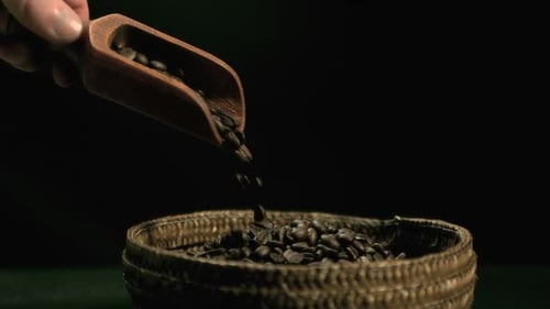 Coffee Beans Being Poured into Basket