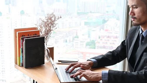 businessman typing a computer keyboard, working at the office or work from home