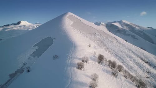 Snow Covered Mountains Aerial View on Sunny Day