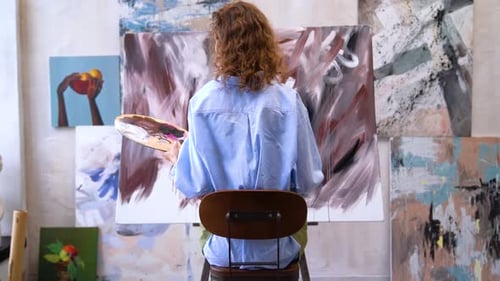Artist Painting Abstract Artwork in Studio