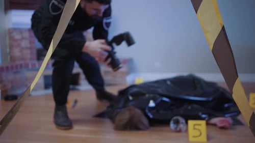 Police Investigator at Crime Scene with Deceased Body