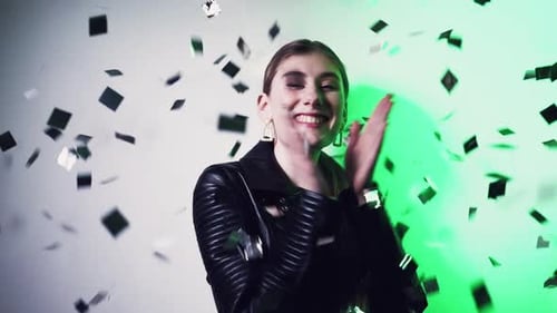 Woman Dancing with Confetti at Party