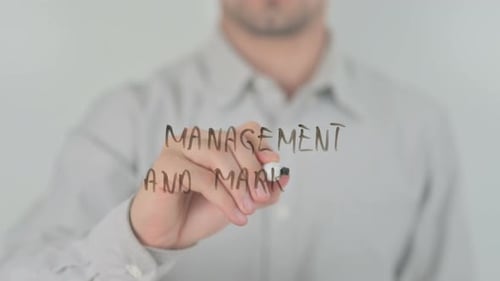 Writing "Management and Marketing" with Marker Close Up