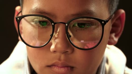 Face Of Asian Boy Hacking Computer System