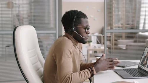 Young Adult in Video Conference at Office
