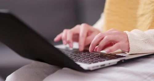 Woman working on laptop computer