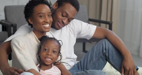 Happy Family Smiling and Posing Together