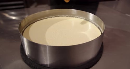 Pouring Caramel on Cake in the Kitchen