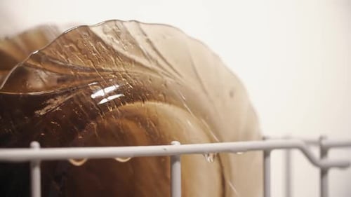 Dishes Being Cleaned Inside Dish Washer