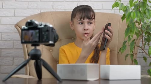Young Girl Vlogging About New Smartphone Indoors