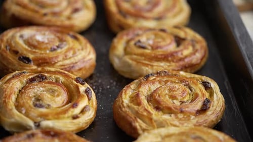 Golden Brown Danish Pastries on Baking Sheet