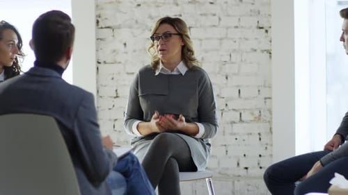 Therapy Session with People Talking Indoors