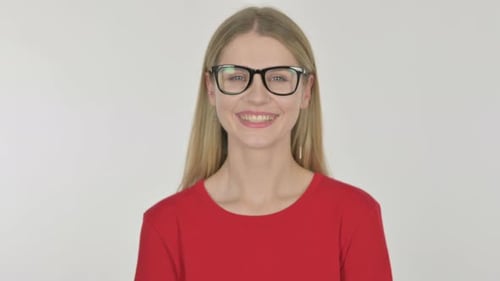 Smiling Woman with Glasses in Front of White Background