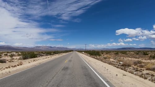 Driving Down the Endless Desert Road. Adventure Travel in a Desert.