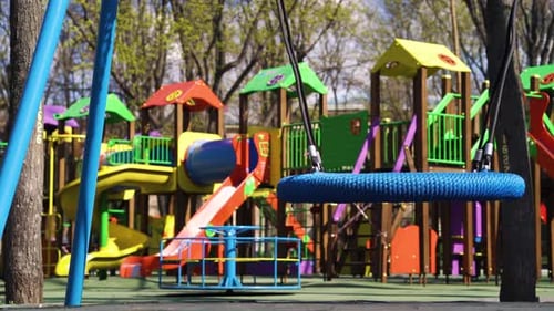 Empty playground with colorful swings and slides during covid19 quarantine