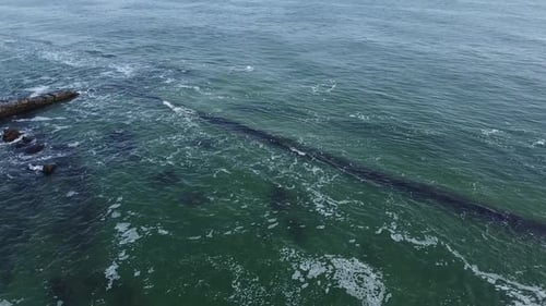 Aerial view drone flies near the sea. Wide view of the water. Beautiful blue sea.