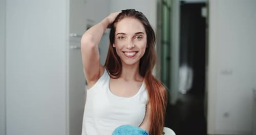 Smiling Woman Poses Casually Indoors