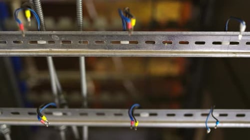Slider Shot of a Blank Metal DIN Rails in Workshop Laboratory