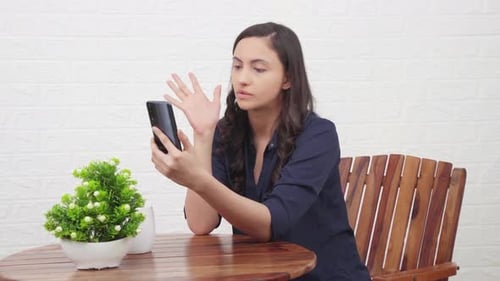 Woman Video Chatting on Phone Indoors