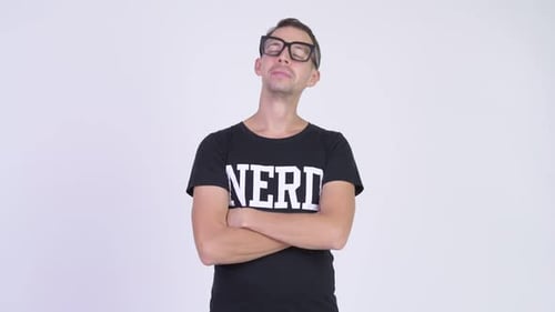 Studio Shot of Happy Nerd Man Smiling with Arms Crossed