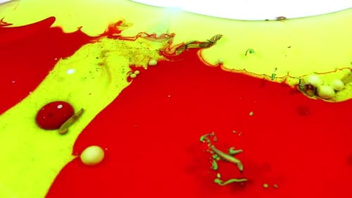 Brightly Colored Paints and Oils Mixing