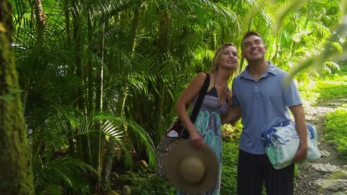 Couple walking down path in tropical jungle, Costa Rica. Shot on RED EPIC for high quality 4K, UHD,