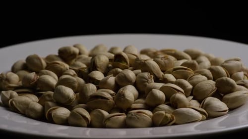 Plate of Pistachios in Shells Close Up