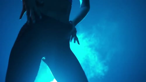 Woman Dancing in Blue Lit Studio, Close Up