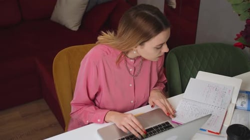 Tired Pretty Caucasian Woman Studying Work on a Laptop at Home Office