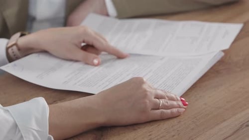 Reviewing Legal Documents at Office Workplace Desk
