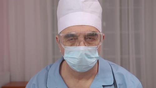 Extreme Close Up Portrait of Doctor Wearing Protective Medical Mask