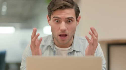 Close Up of Creative Young Man Feeling Loss on Laptop