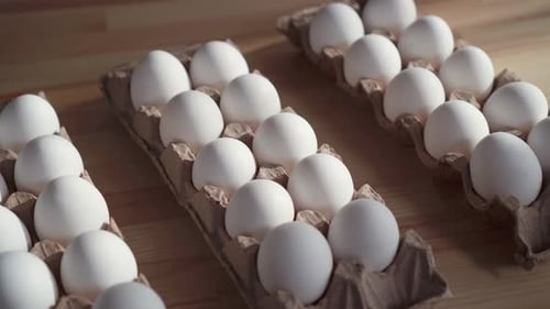 Few Eggs in a Cardboard Box on the Table