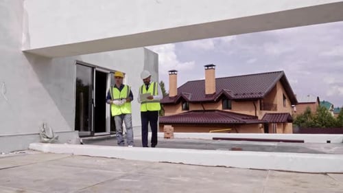 Building Supervisor Checking Work Progress
