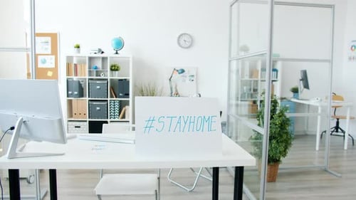 Contemporary Office with No People and Stayhome Banner Because of Covid-19 Epidemic