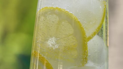 Lemon Water and Ice in Glass Close Up
