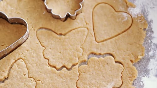 Close Up of Cookie Dough and Cookie Cutters