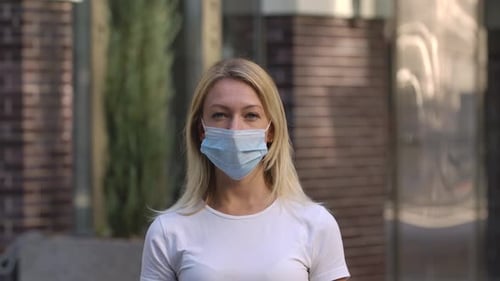 Woman Wearing Medical Face Mask in City
