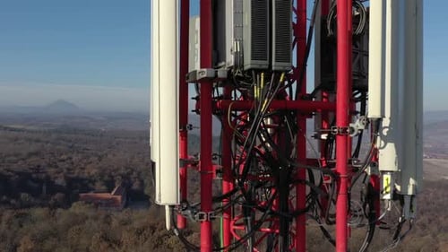 Tilting on telecommunication tower equipment aerial 4K footage