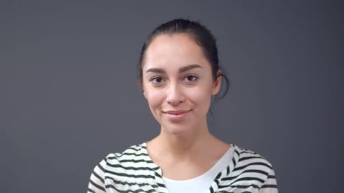 Smiling Woman Winks at the Camera