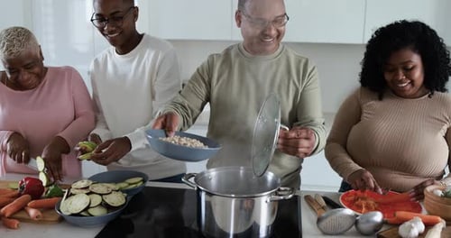 Family Prepares Healthy Meal in Modern Kitchen Together