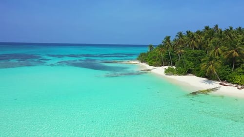 Aerial drone shot travel of idyllic island beach holiday by turquoise lagoon and white sand backgrou