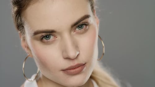 Blonde Woman Close Up Looks At Camera