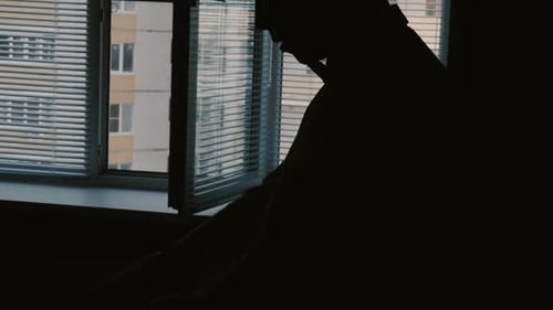 Silhouette Men Dress Shirt Near a Window