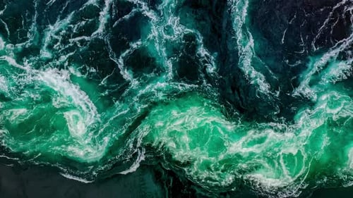 Waves of Water of the River and the Sea Meet Each Other During High Tide and Low Tide
