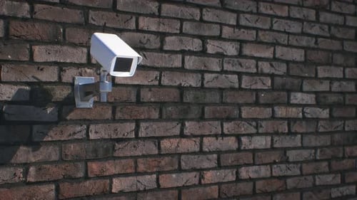 Security Camera Mounted on a Brick Wall