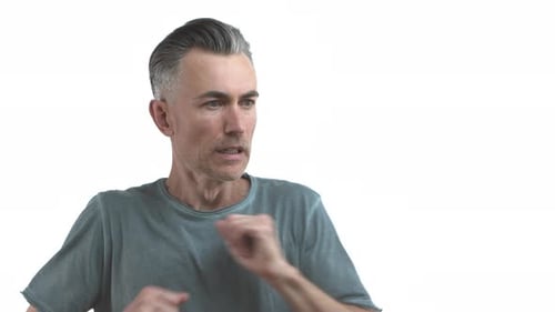 Man in grey t-shirt talking and moving hands