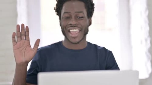Close Up of African Man Doing Video Chat on Laptop